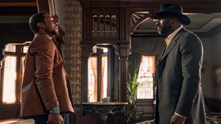 Jonathan Majors and Idris Elba in a stand off in Netflix's The Harder They Fall