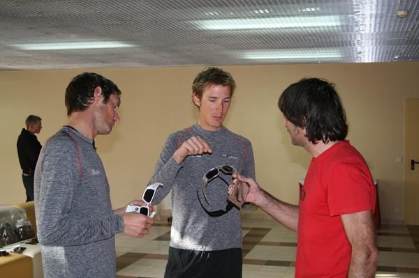 Kiko Garcia of Oakley gives the Schleck brothers some new eyewear.