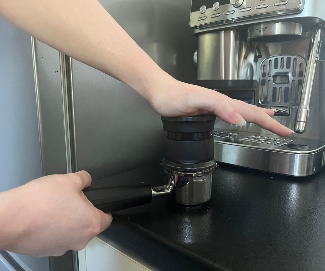 Tamping down grounds in the ninja luze cafe mini portafilter
