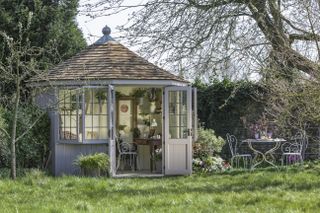 grey garden room shed office with tiled roof