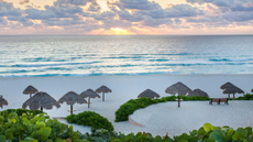 Sunrise over Playa Delfines in Cancun, Mexico