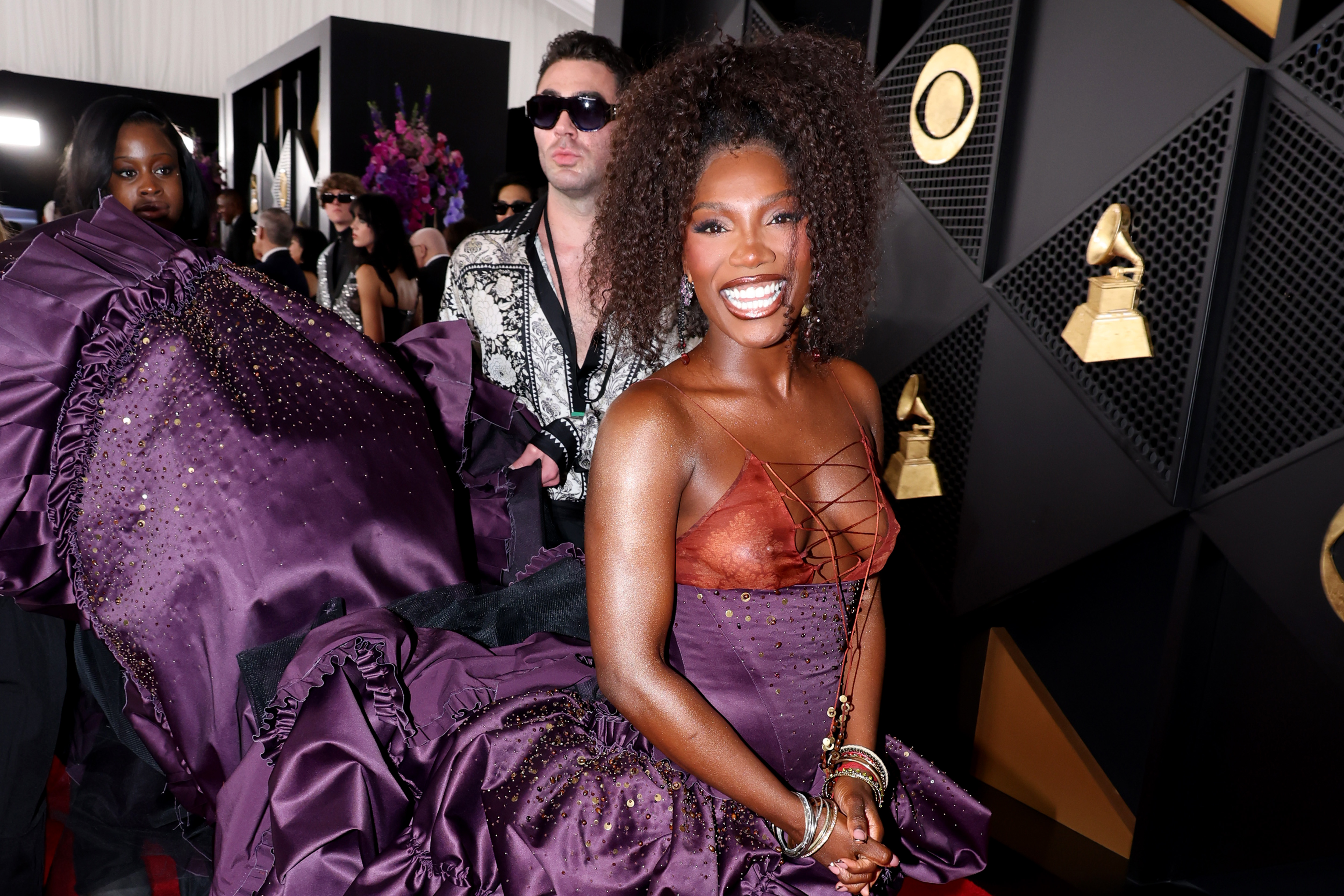 Doechii wearing a curly high ponytail hairstyle at the Grammys