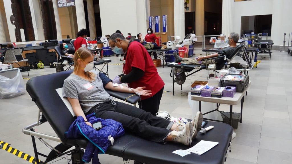 A woman donates blood.