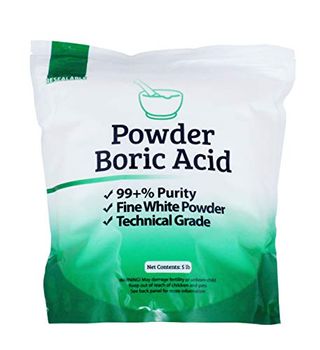 White to green fade on plastic bag labelled Powder boric Acid