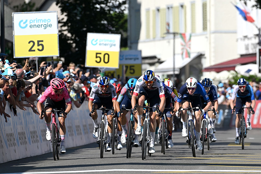 NEUHAUSEN AM RHEINFALL, SWITZERLAND - JUNE 20: Jordi Meeus of Belgium and Team Red Bull - BORA - hansgrohe celebrates at finish line as stage winner ahead of (L-R) Madis Mihkels of Estonia and Team EF Education - EasyPost, Davide Ballerini of Italy and Team XDS Astana and Lewis Askey of Great Britain and Team Groupama - FDJ during the 88th Tour de Suisse 2025, Stage 6 a 186.7km stage from Chur to Neuhausen am Rheinfall / #UCIWT / on June 20, 2025 in Neuhausen am Rheinfall, Switzerland. (Photo by Tim de Waele/Getty Images)