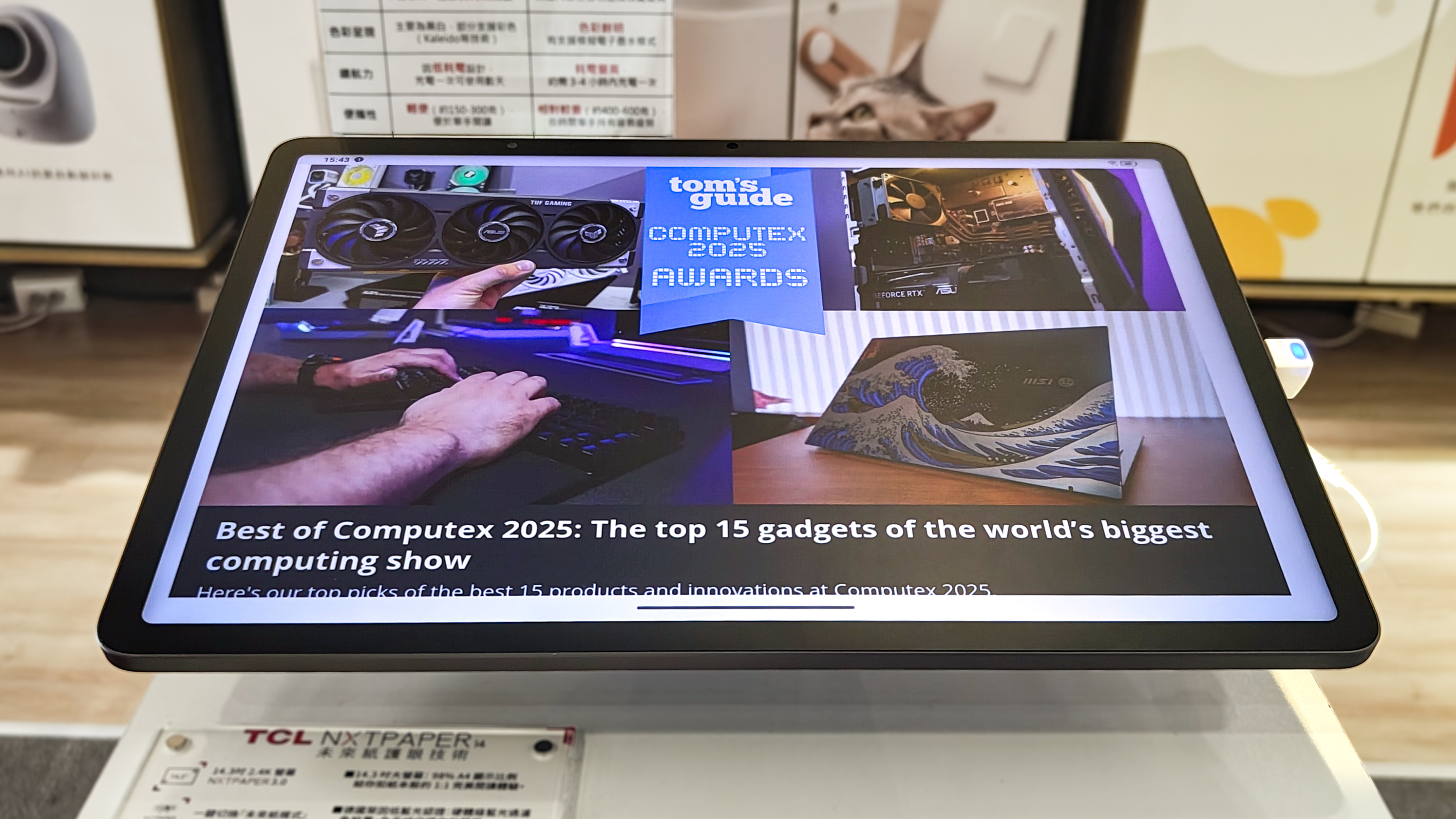 The Tom's Guide home page on the TCL NXTPAPER 14 tablet in a mall in Taiwan