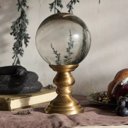 Crystal ball ornament on a bronze base