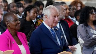 Baroness Amos sits next to King Charles III during a service at St George's Chapel, Windsor Castle for young people, to recognise and celebrate the Windrush 75th Anniversary