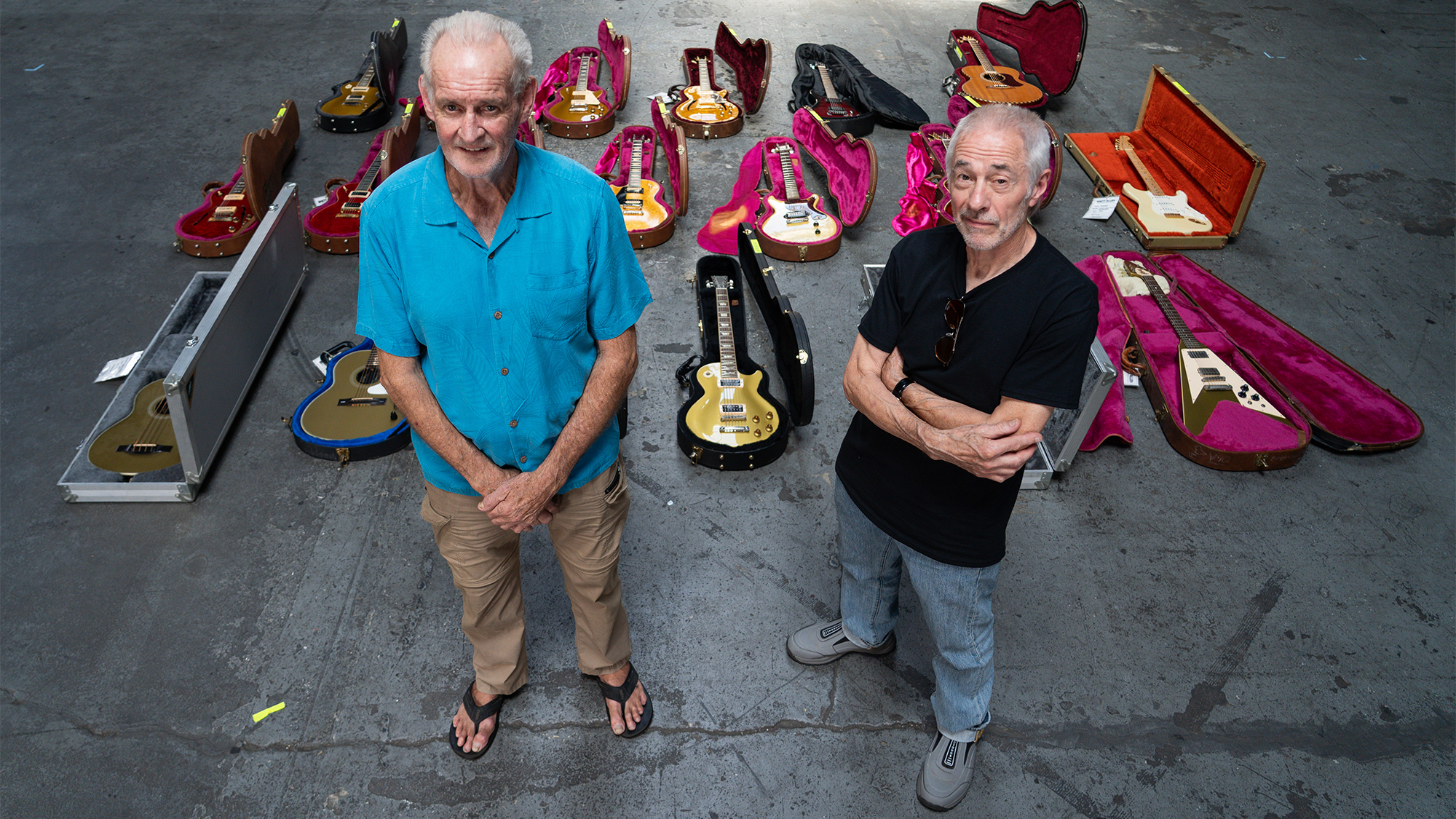 Brett Allen (left) and Roger Giffin pose with guitars from the Outlaw Custom Shop Collection