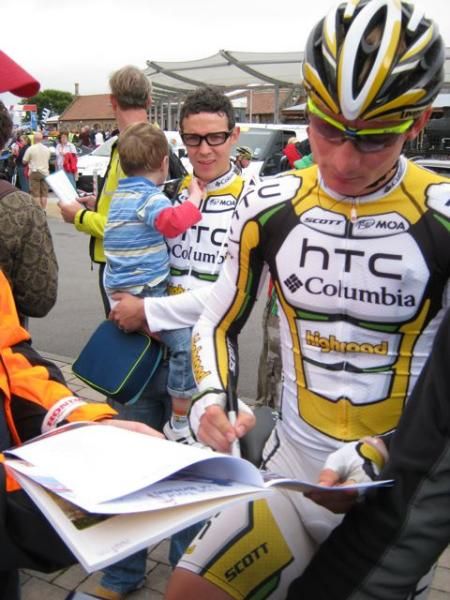 Andre Greipel signs an autograph.