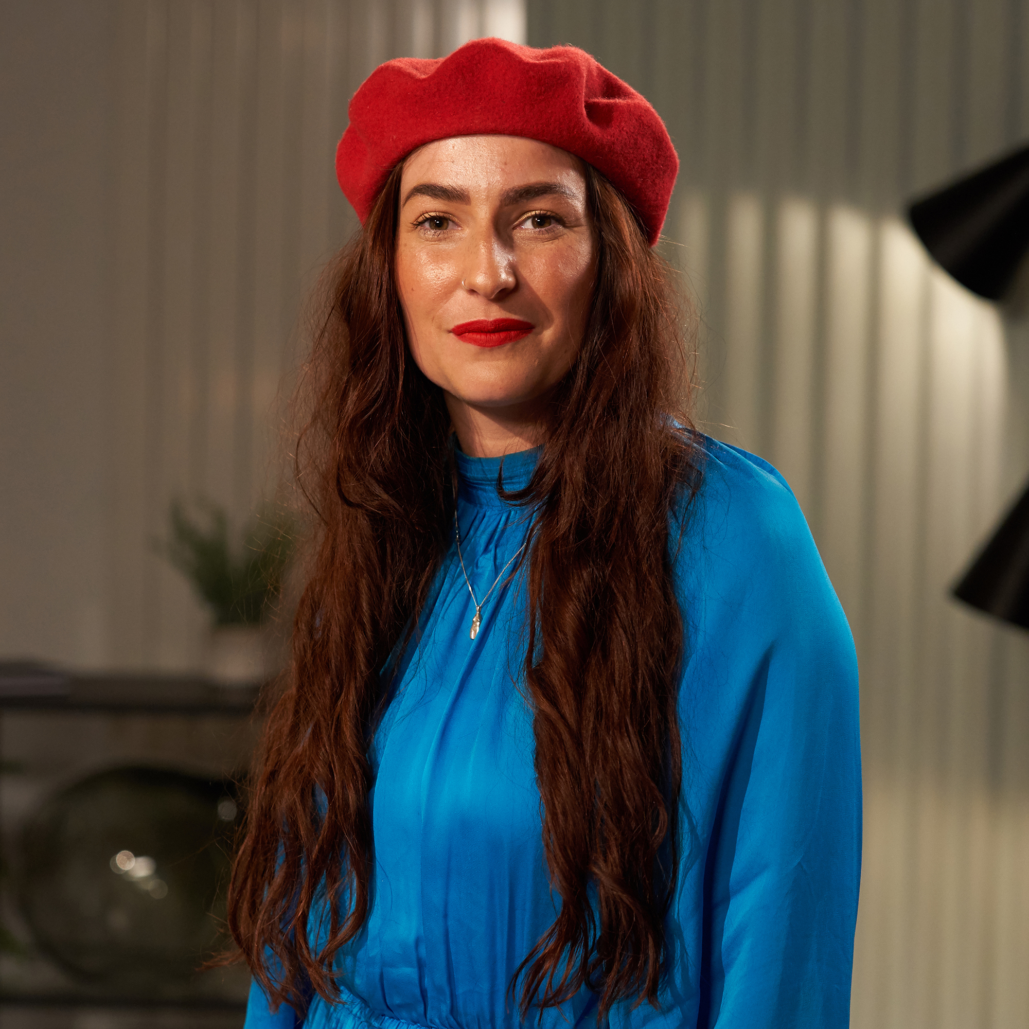 Women with red beret and blue dress