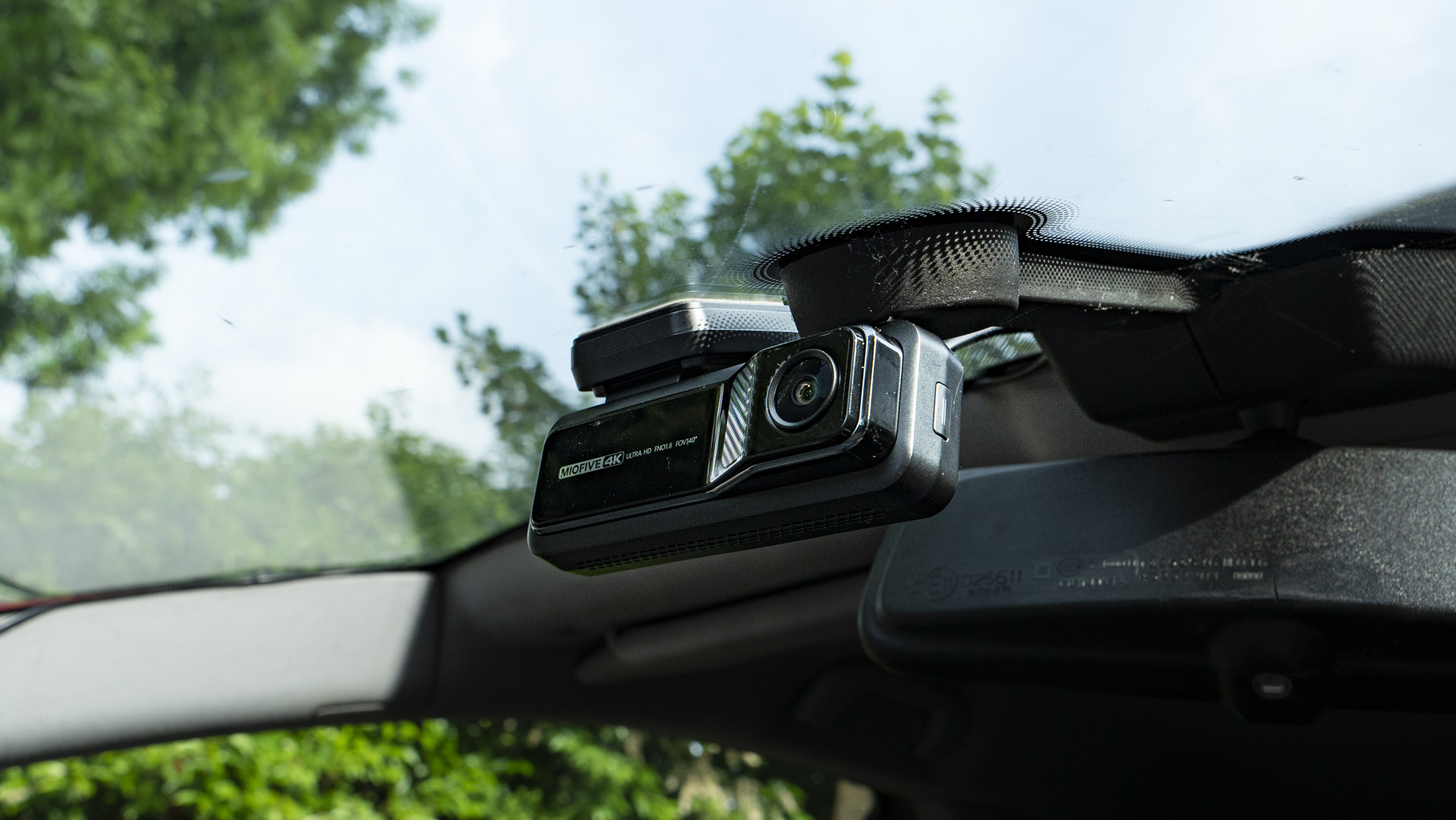 Miofive Dual Dash Cam front camera attached to a windscreen