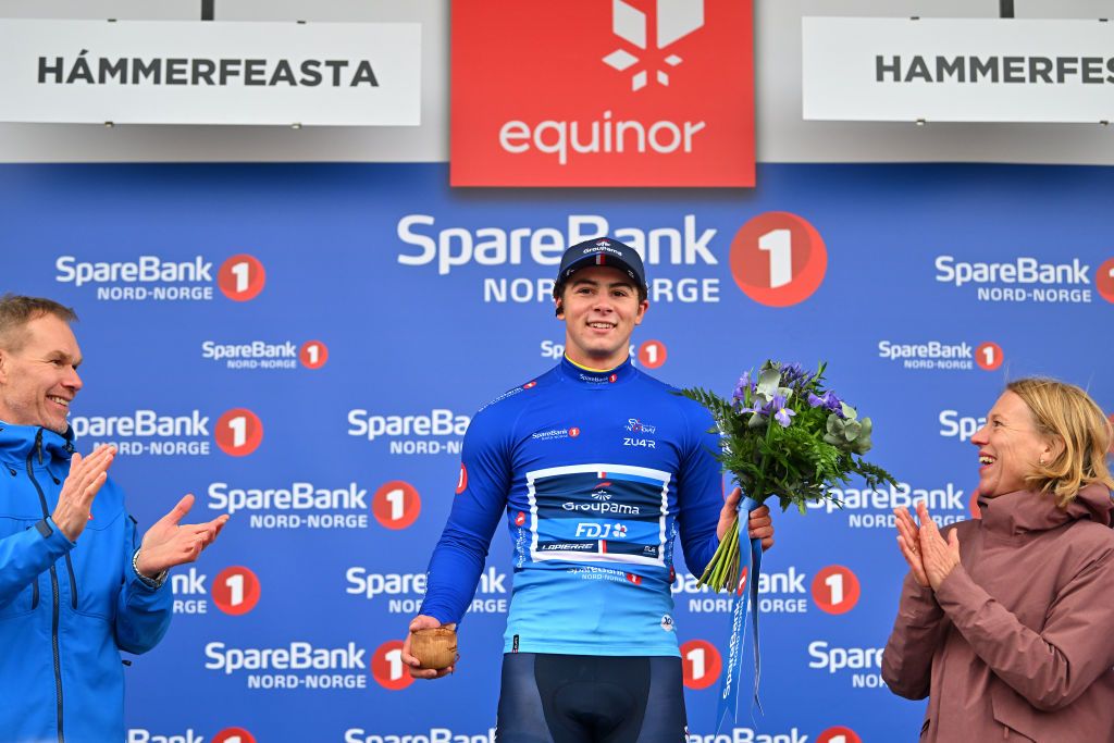 HAMMERFEST NORWAY AUGUST 18 Noah Hobbs of Great Britain and Team GroupamaFDJ Continental celebrates at podium as Blue Points Jersey winner during the 10th Arctic Race of Norway Stage 2 a 1534km stage from Alta to Hammerfest on August 18 2023 in Hammerfest Norway Photo by Luc ClaessenGetty Images