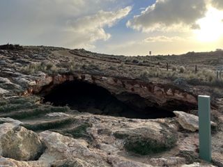 The sinkhole is roughly 40 feet in diameter, or about half the size of a tennis court.