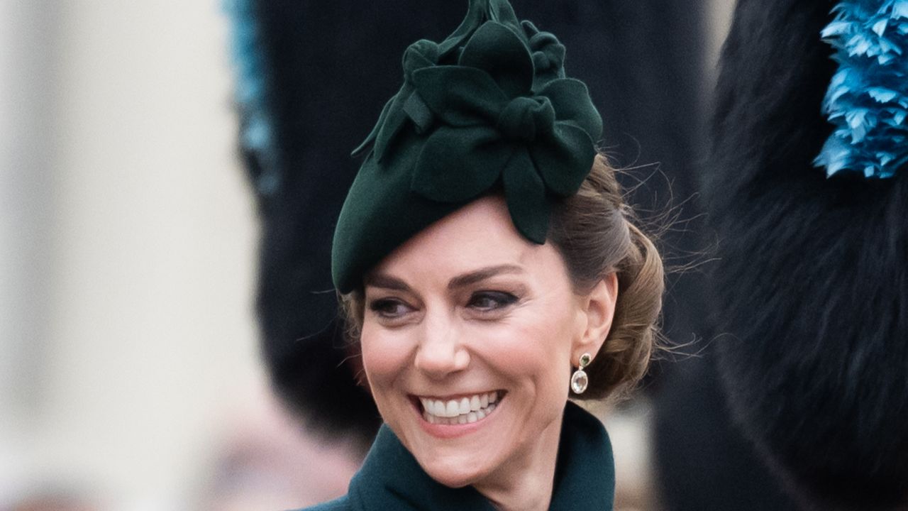 Kate Middleton wearing a green coat and hat and smiling on St. Patrick&#039;s Day 2025