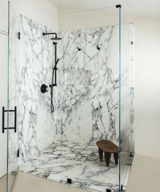Marble shower, black handles