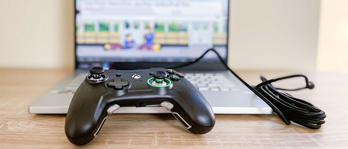 Nacon RIG Revolution X gamepad plugged into laptop