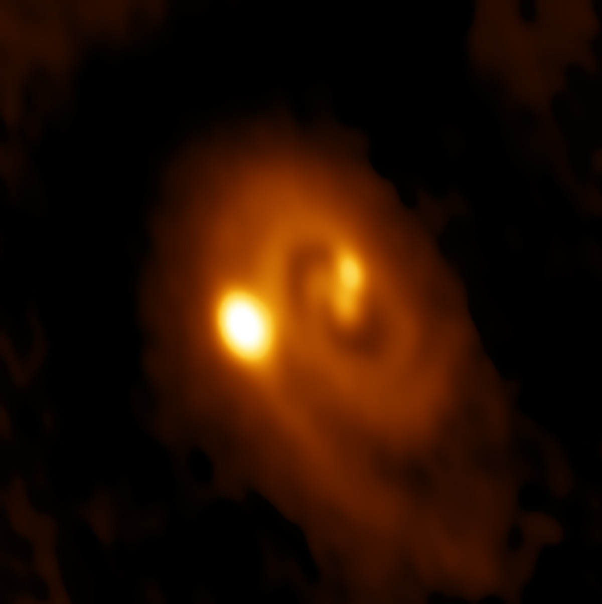 An orange spiral with three bright spots; two near the center and one further out.