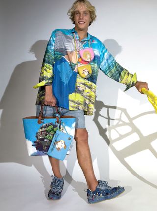 Boy wearing Loewe x Studio Ghibli patterned clothing and bag