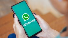 In this photo illustration, the WhatsApp logo is displayed on a smartphone screen.