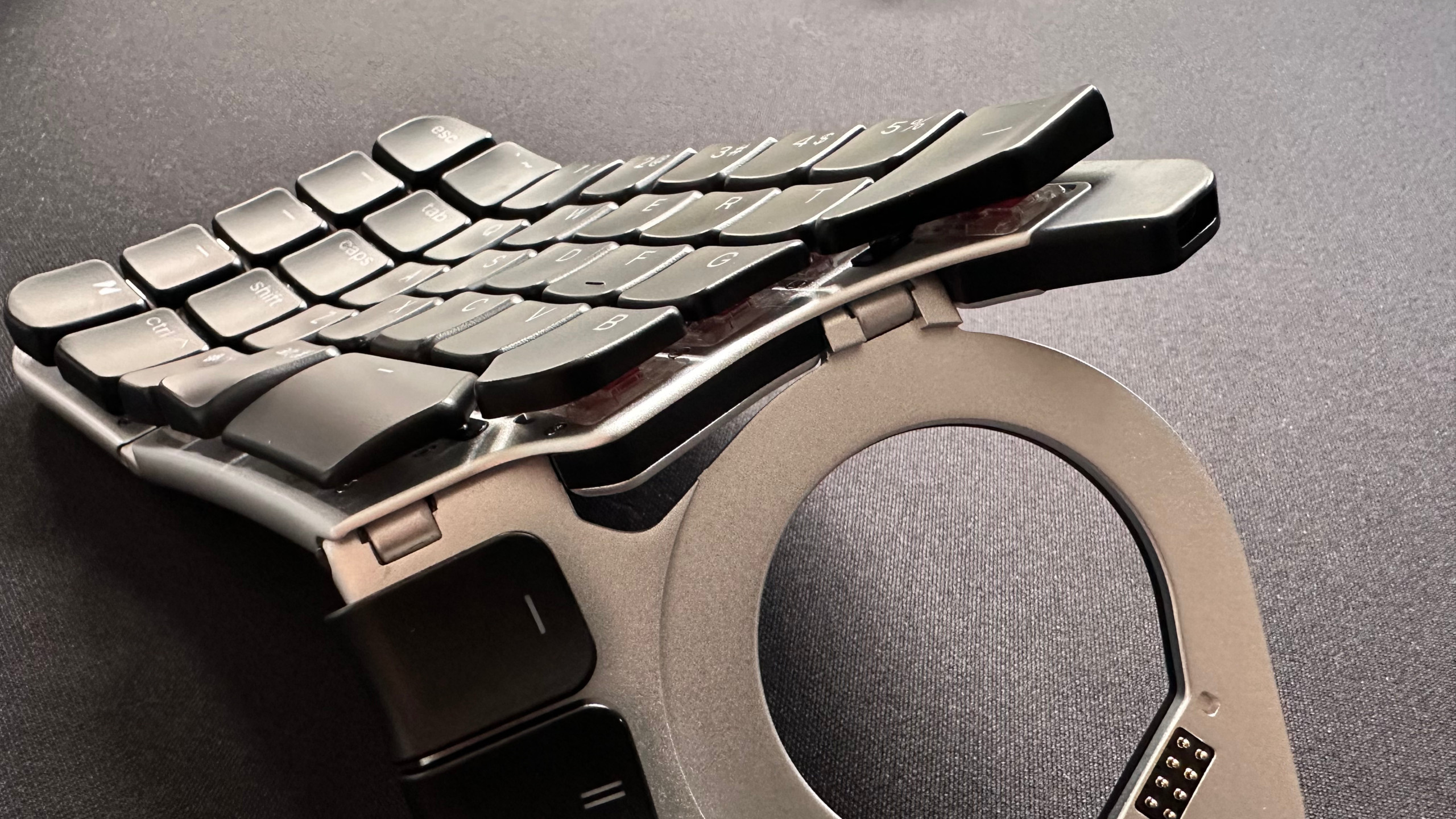 A photo of the Naya Create ergonomic keyboard, showing the hinge mechanism