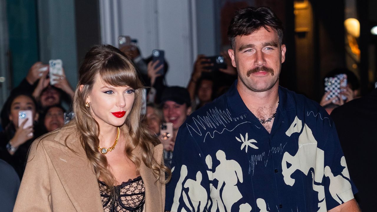 Taylor Swift holds hands with Travis Kelce