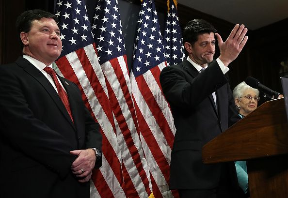 Rep. Todd Rokita listens to House Speaker Paul Ryan.