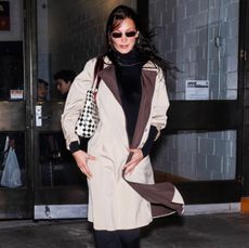 Bella Hadid made her street style comeback in a black outfit and trench coat