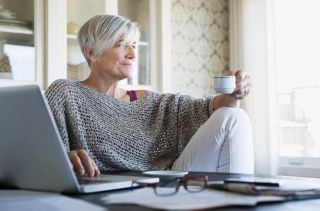 picture of elderly woman drinking coffee at home