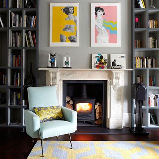 living room with fireplace and armchair with cushion