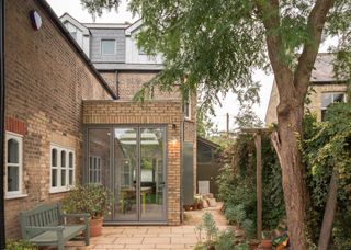 small single storey extension with taupe aluminium bifold doors