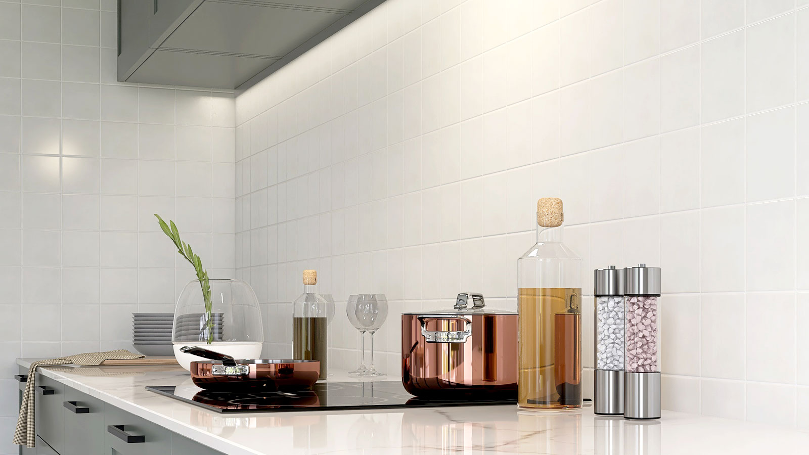 Modern kitchen with grey cabinets, white marble-like worktop with white tiled splashback and walls