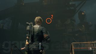 Resident Evil 4 Remake Cargo Depot blue medallion hanging high up off a metal walkway