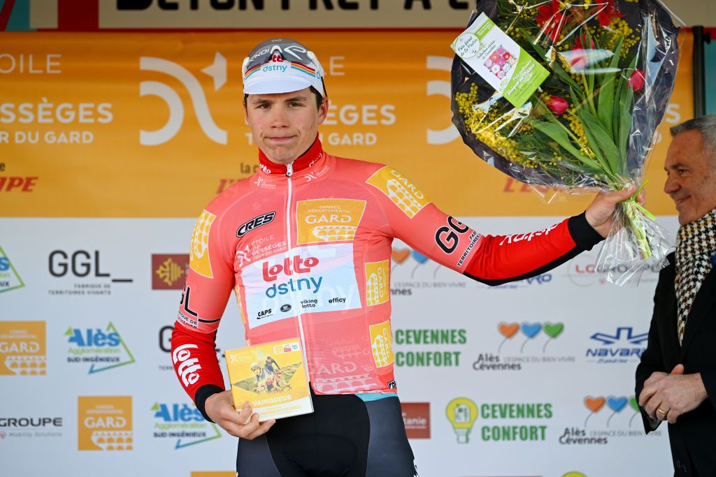 BELLEGARDESURVALSERINE FRANCE FEBRUARY 01 Arnaud De Lie of Belgium and Team Lotto Dstny celebrates at podium as Orange leader Jersey during the 53rd Etoile de Besseges Tour Du Gard 2023 Stage 1 a 16218km stage from Bellegarde to Bellegarde EDB2021 on February 01 2023 in BellegardesurValserine France Photo by Luc ClaessenGetty Images