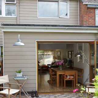 Rear of house with grey panelled kitchen-dining room extension
