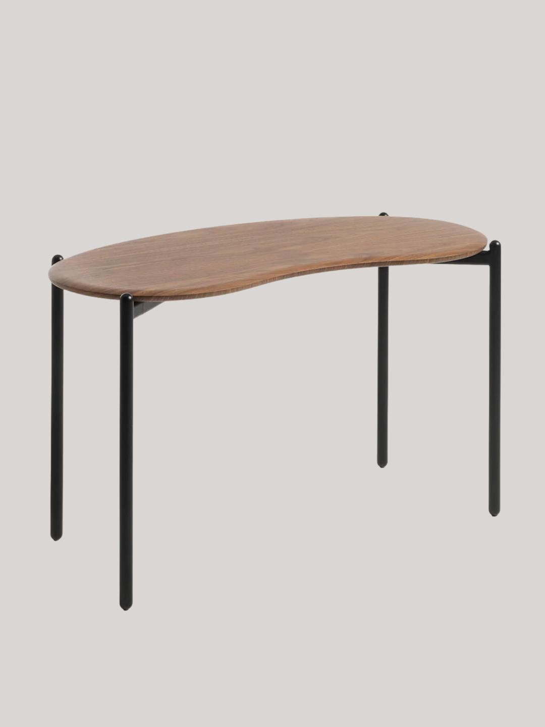 A bean-shaped walnut top desk on a black base from Kartell