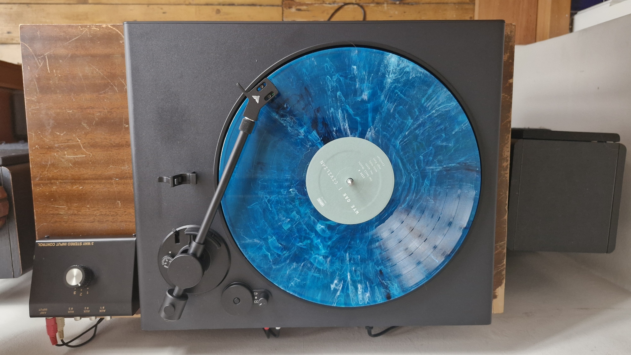 The Victrola hi-res onyx turntables on a wooden surface.