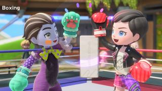 Players fist-bump before a boxing match in Nintendo Switch Sports Resort