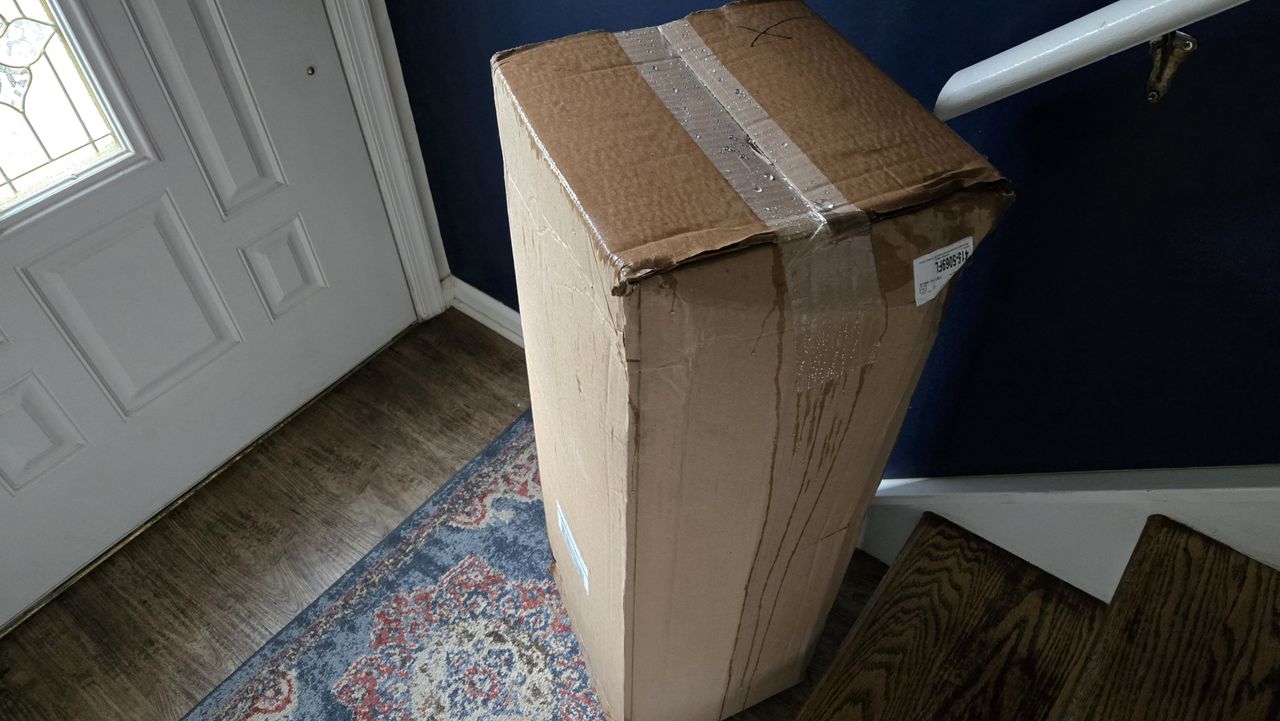 Helix ErgoAlign Mattress Topper in a box by the front door of tester's vestibule