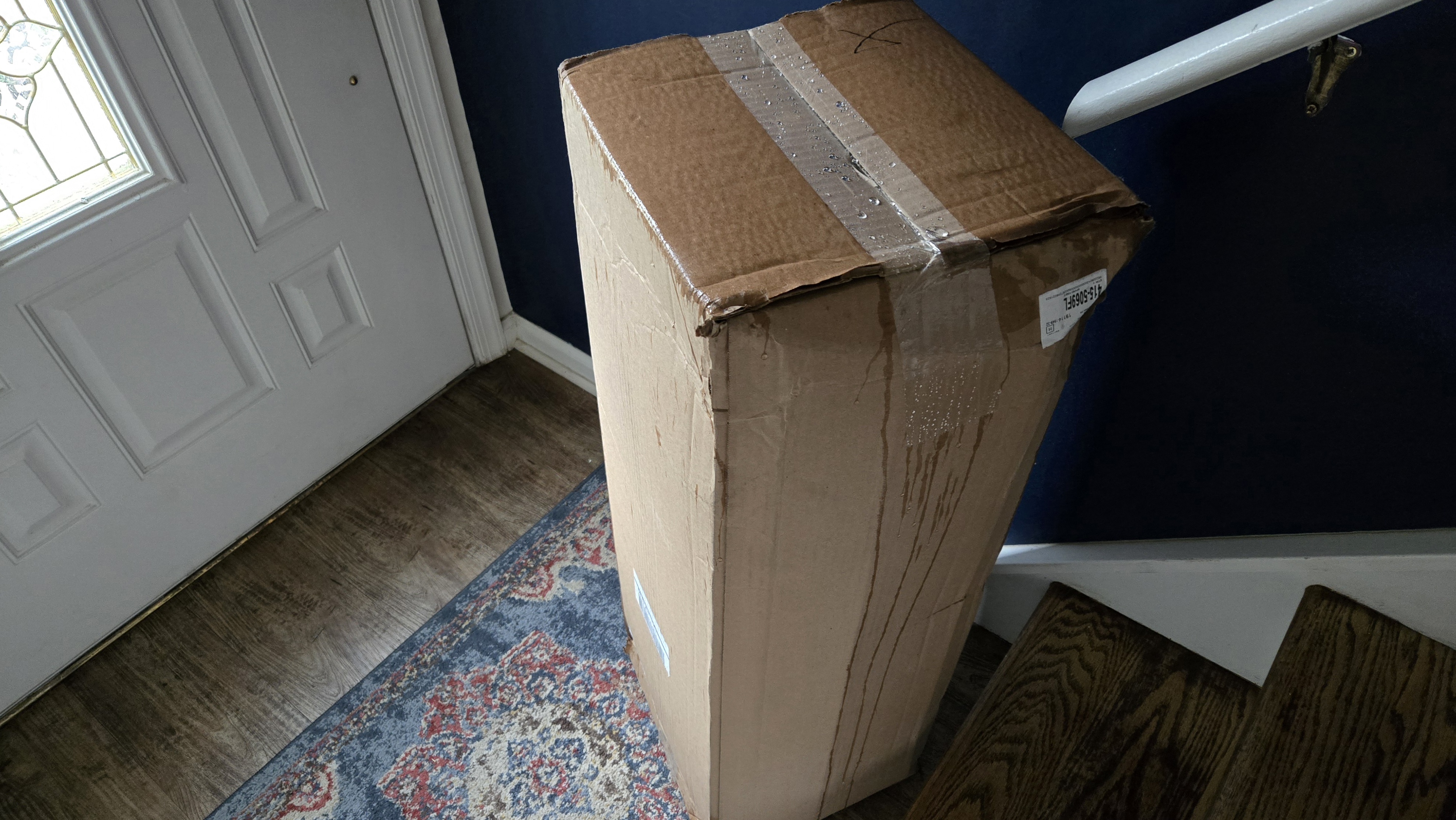 Helix ErgoAlign Mattress Topper in a box by the front door of tester's vestibule