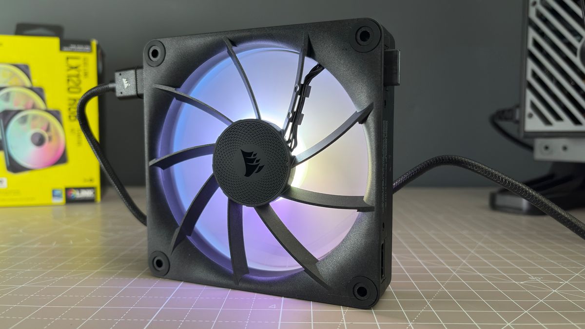 Various PC fans on a table with testing equipment for a round of batch tests.