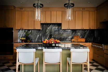 a modern kitchen with a marble countertop