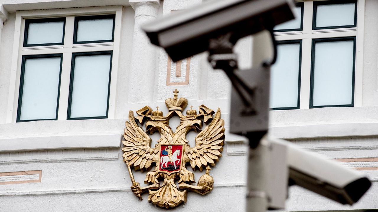 An exterior view of the Russian Embassy in The Hague, Netherlands, with a security camera watching over.