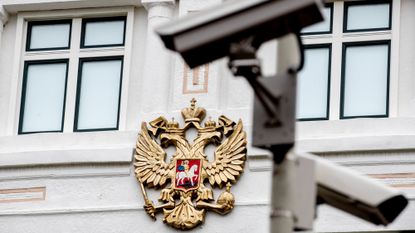 An exterior view of the Russian Embassy in The Hague, Netherlands, with a security camera watching over.