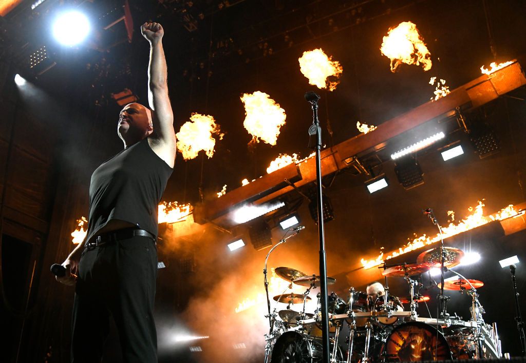 A picture of David Draiman of Disturbed performing on stage