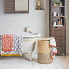 Woven laundry basket in bathroom