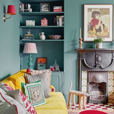 blue/green colour living room and alcove with yellow sofa and various lampshades