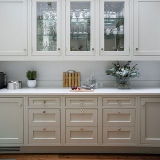 kitchen with white cabinet and crockery unit