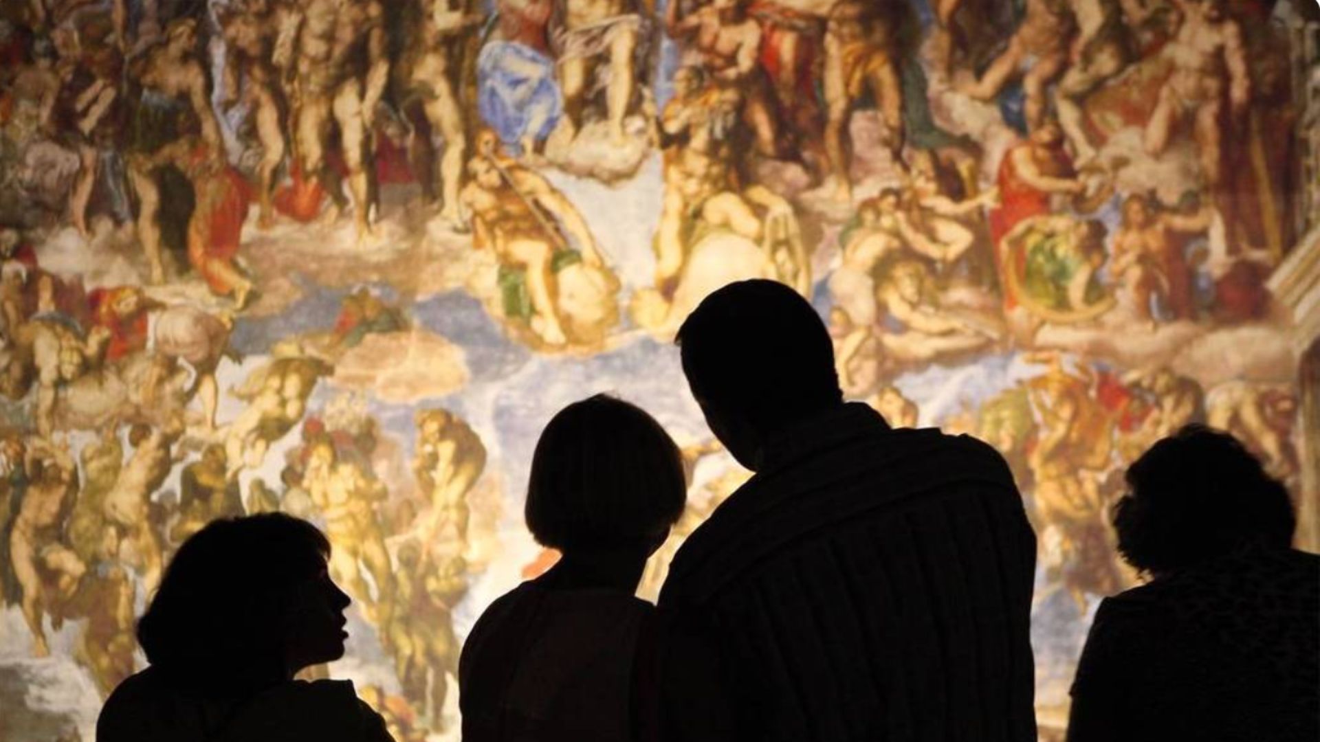 an image showing guests looking at one of the works