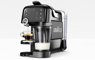 Fantasia lavazza coffee machine with milk frother and coffees
